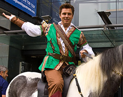John as Robin Hood on horseback
